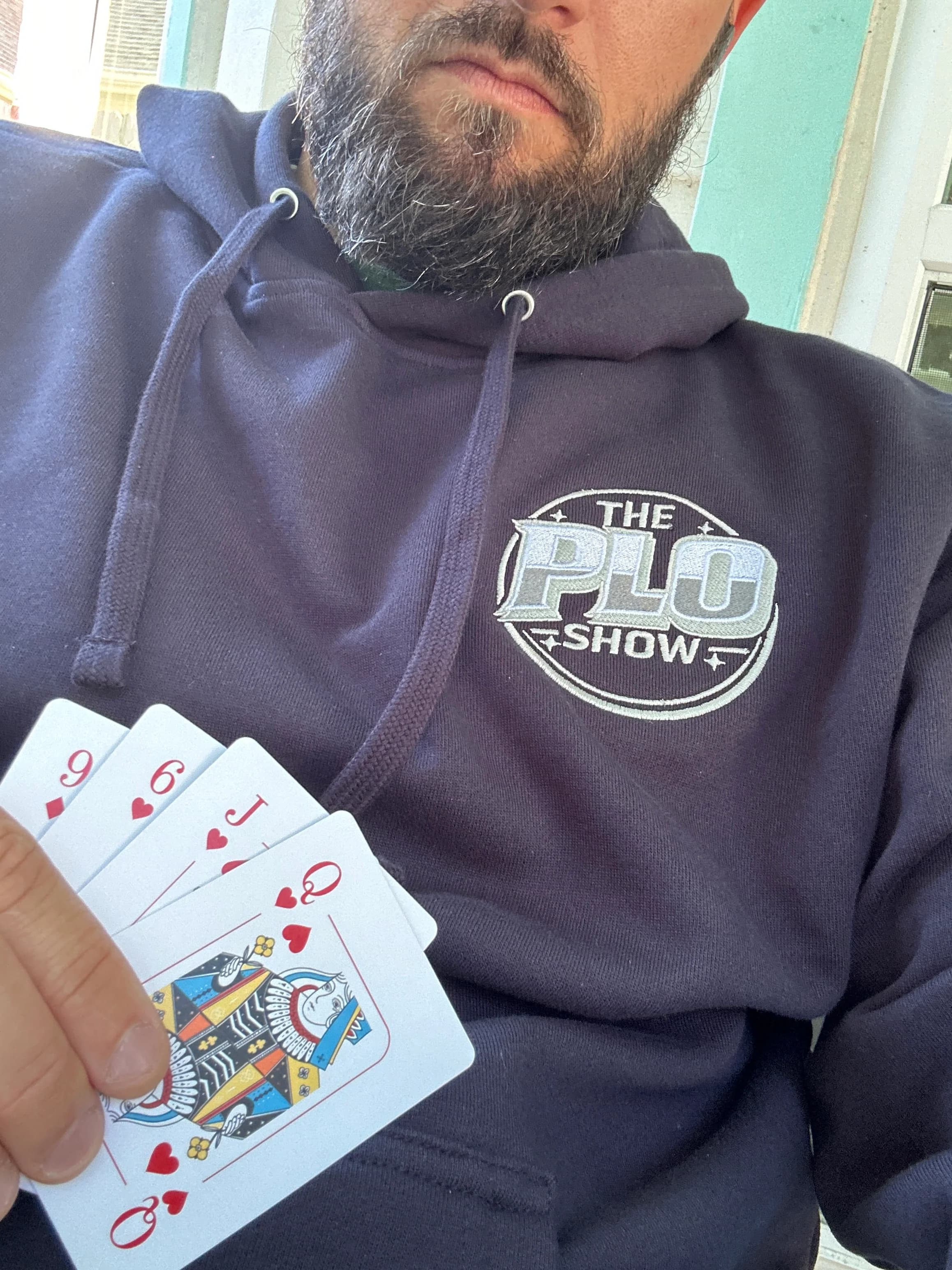 PLO Show navy hoodie close-up with a Pot-Limit Omaha hand