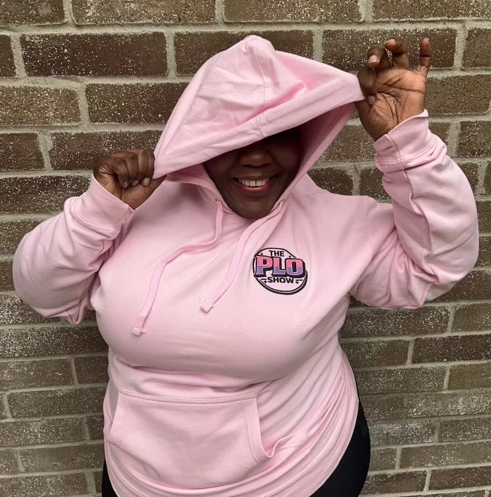 PLO Show fan in the pink hoodie with the multicolor logo